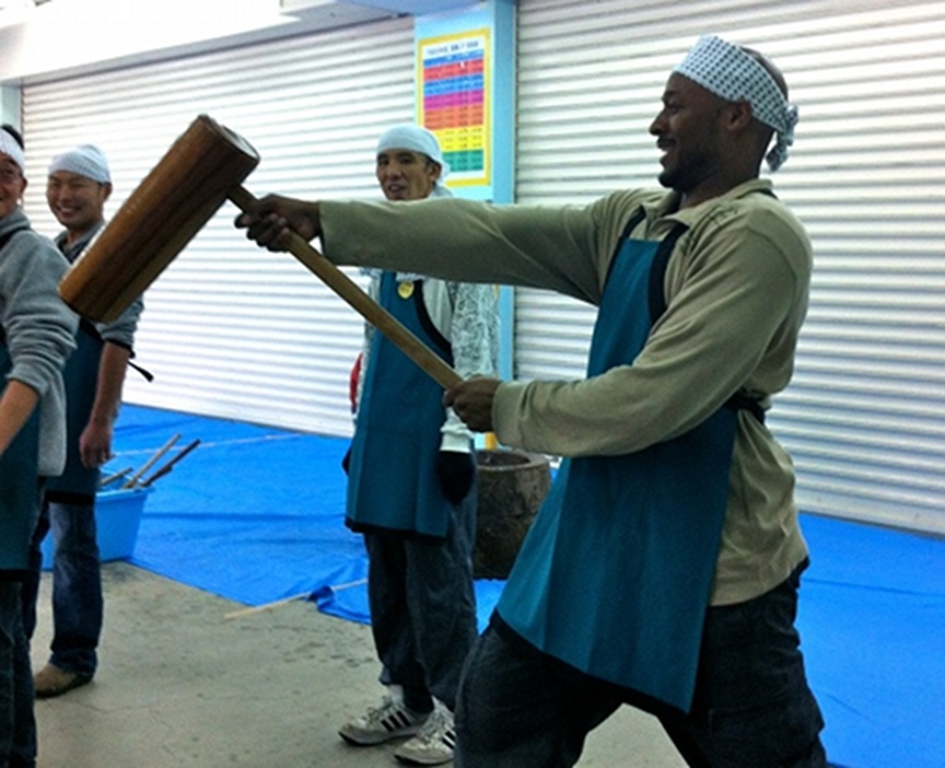 Holding a mochi hammer